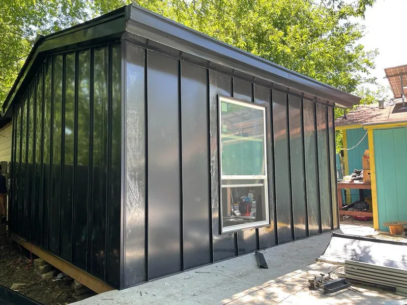 Black standing seam metal wall panels for Roof Inspection in Hopkins