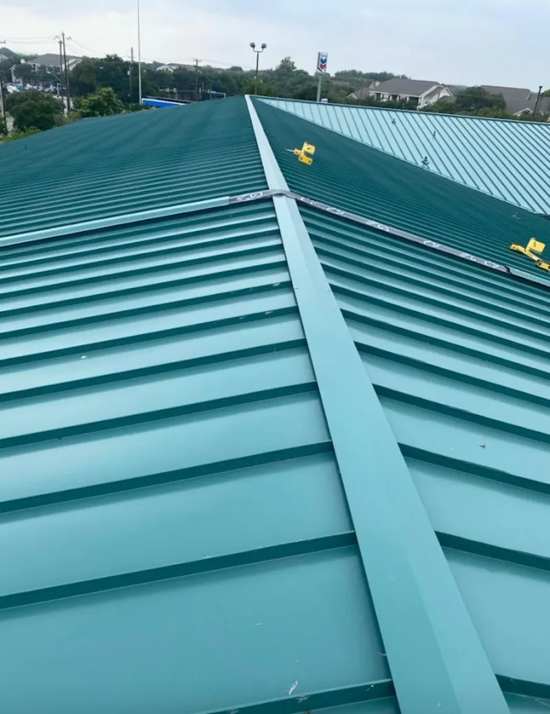Green commercial metal roof ridge and valley for Metal Roof Repair in Hopkins