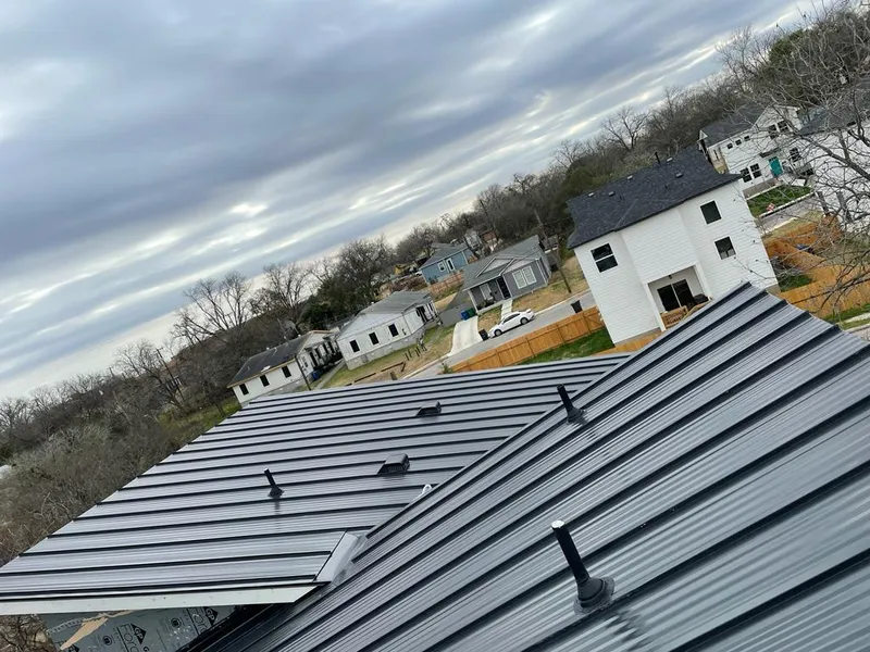 Standing seam metal roof panels with vents for Skylight Repair in Hopkins